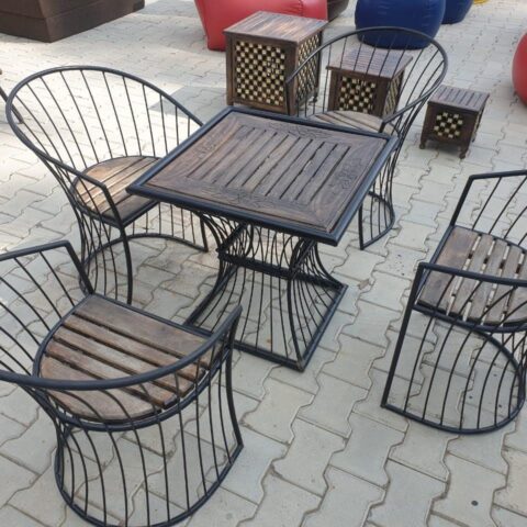 NATURAL ART & CRAFT : "Elevate your outdoor or indoor space with this stylish Wood & Wrought Iron Patio Furniture Set. A perfect blend of durability and elegance in brown and black, offering both comfort and timeless design for any garden or living area."